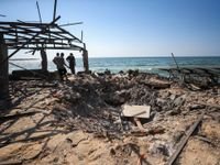 Israeli Strike on Gaza Café Claims Lives of 30 Palestinians