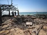 Israeli Strike on Gaza Café Leaves 30 Palestinians Dead